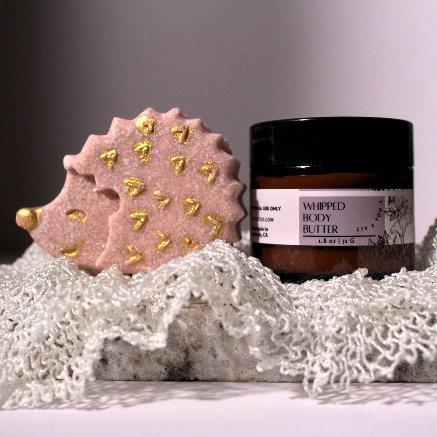 Hedgehog sea salt spa bar with gold paint and whipped body butter on African Net Cloth for Liv 4 You 2.
