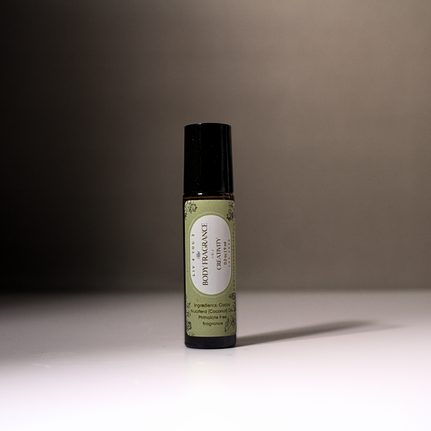 All Natural Roll On Body Perfume in brown glass, black top, green and white label for Liv 4 You 2