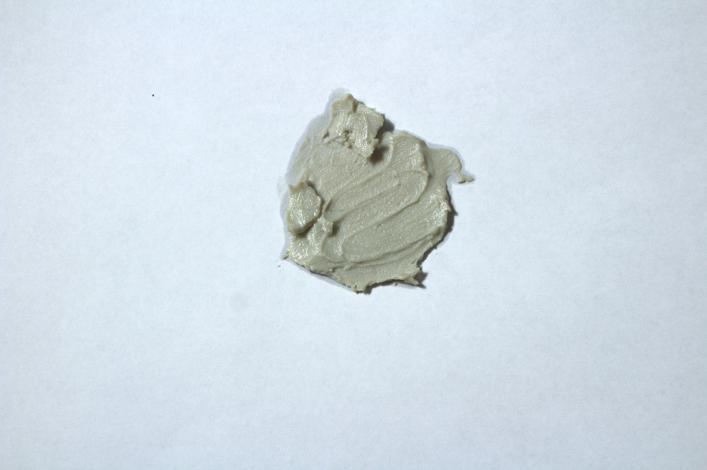 Green facial cleansing balm on white surface Liv 4 You 2